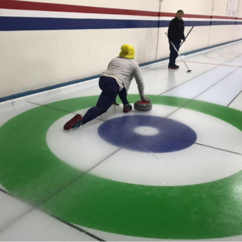 Picture of Dr. Ngoc Thien Nguyen playing the sport curling.